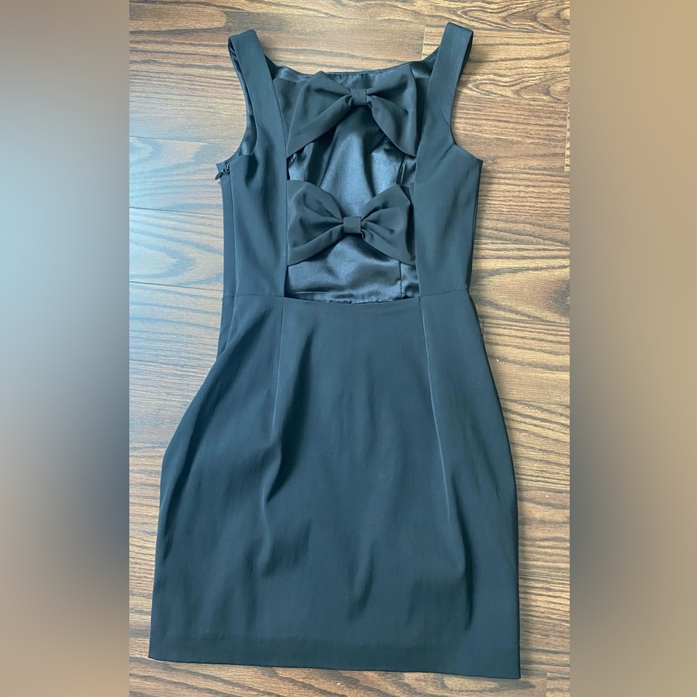 Little black dress with bows on back. Good quality gorgeous material.